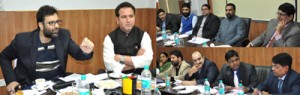 Revenue Minister interacting with officers on Friday. 