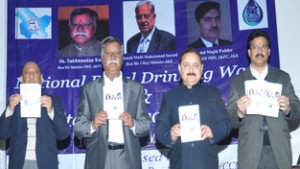 PHE Minister Sukhnandan Kumar releasing awareness material on Monday.