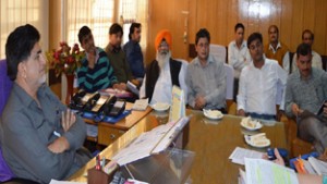 Minister of State for Transport, Abdul Ghani Kohli chairing a meeting at Jammu on Monday.