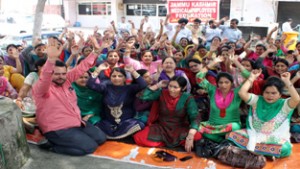 FMPHWs raising slogans for release of salary during a protest dharna on Tuesday.     —Excelsior/Rakesh