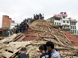 People survey a site damaged by earthquake in Kathmandu on Saturday. (UNI)