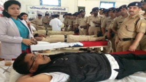 CRPF personnel donating blood during a blood donation camp at headquarters of 126 battalion in Bidda, Reasi.