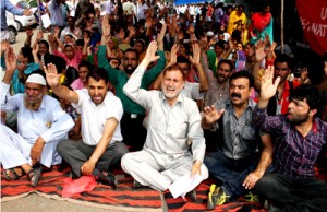 Casual labours and Anganwadi workers staging protest dharna in Jammu on Wednesday.— Excelsior/Rakesh