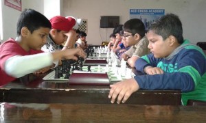 Young chess players concentrating hard while making moves during the matches of Jammu Division Selection Chess Tournament at Ace Chess Academy in Jammu.