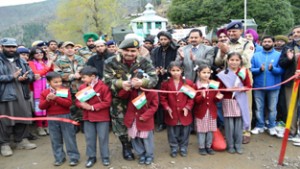 Army School children along with dignitaries during inauguration of medical camp organized by Rashtriya Rifles. 