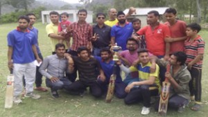 Winners of cricket tournament posing along with officials at Nowshera in Rajouri.