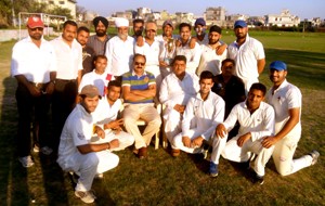 Triumphant RCC Srinagar players posing along with office bearers of the Club after lifting KCSC T20 Cup in Jammu on Thursday.