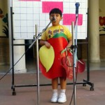 Child displaying singing talent at GD Goenka in Jammu.
