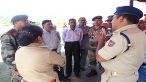 Police and Army officers interacting with local people during an awareness camp organized at Jhangar, Nowshera in Rajouri district.