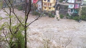 Sewa river flows above danger mark in Bani area of Kathua district on Friday. 