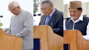 Governor NN Vohra administering oath to Chering Dorjey and Abdul Ghani Kohli at Raj Bhawan in Jammu on Friday.