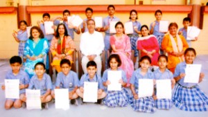 Meritorious students of KC Public School posing along with Principal, Amarendra Kumar Mishra and other dignitaries on Thursday.      