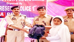 SSP IRP 1st Battalion, T R Katoch distributing stationary items among school children in Reasi on Thursday.