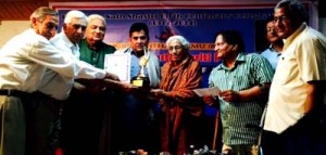 Writer-journalist, Rajeshwar Singh Raju, receiving Prof Ram Nath Shastri Memorial Award from dignitaries at Jammu on Wednesday.