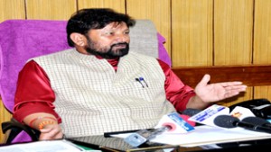 Minister for Health, Ch Lal Singh addressing a press conference.