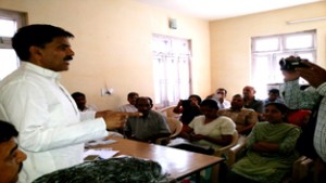 NPP chairman Harshdev Singh addressing party workers during meeting in Jammu on Tuesday.