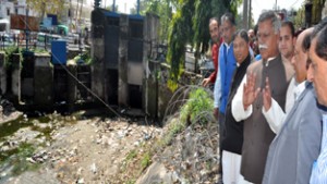 Minister for PHE, Sukhnandan Chowdhary inspecting renovation & repairs of canal at Jammu on Wednesday.