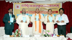 Dignitaries on dais releasing a book during Annual Day celebration by Rashtriya Sanskrit Sansthan on Friday.
