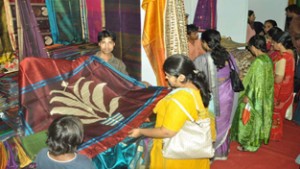 Women having glimpses of products during Weaves handloom expo at Jammu on Thursday.