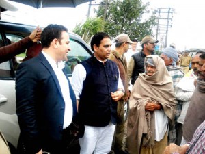 Minister of State for Revenue, Sunil Kumar Sharma interacting with people during his tour to R.S Pura on Tuesday.