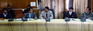 DM Saugat Biswas chairing a meeting at Leh on Friday.