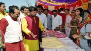 Health Minister Ch Lal Singh inspecting stalls at Border Festival on Thursday.