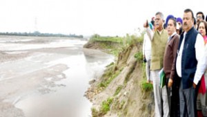 Minister for PHE, Sukhnandan Kumar and Minister for Industries, Chander Prakash taking stock of damages due to floods in Vijaypur on Friday.