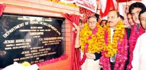 Minister for Rural Development, Abdul Haq Khan and Minister for PHE, Chowdhary Sukhnandan Kumar laying foundation stone of Model Village at Sangrampur on Tuesday.