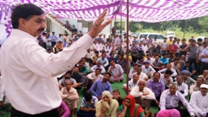 Minister of State for Finance, Pawan Gupta addressing public gathering after inaugurating Panchayat Ghar at Jib on Sunday.