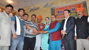 Dy Chief Minister, Dr Nirmal Singh giving away prize on Thursday.