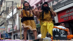 Artists dressed up as Lord Shiva and Bhagwan Parshuram during Shobha Yatra at Jammu on Monday. -Excelsior/Rakesh