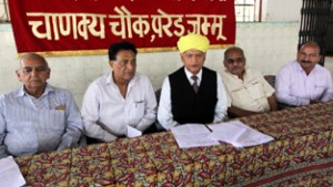 President of Dogra Brahman Pratinidhi Sabha addressing a press conference on Friday. -Excelsior/Rakesh