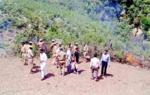 Forest and police team removing encroachment on Govt land in Basohli.