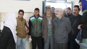 Minister for Education, Naeem Akhtar interacting with staff members while his visit to Women’s college, M A Road Srinagar on Saturday.