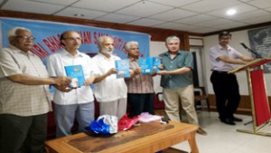 Scholars releasing Dr R L Bhat’s book on Abdul Ahad Azad at Jammu on Sunday. -Excelsior/Rakesh