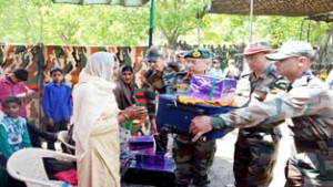 Lt Gen K H Singh felicitating a war widow during rally at Samote.