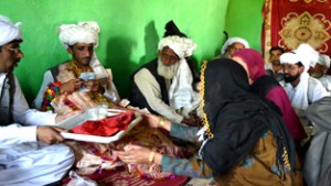 Gujjars’ marriage ritual: Sister-in-law offering milk to groom.