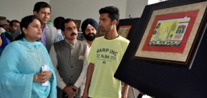 Minister of State for Information, Priya Sethi having a look at art piece in an exhibition at Jammu on Tuesday. 