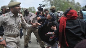 Police cane charging protesters on Tuesday.  -Excelsior/Amin War