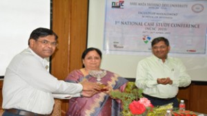 Nishi Sharma, Vice-president, J&K Bank, receiving memento from a dignitary at a function in SMVDU, Katra.