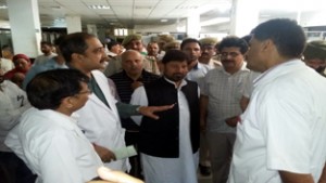 Health and Medical Education Minister Lal Singh being briefed by GMC MS Dr Rabinder Ratanpal and RMO Dr Sujay Mahajan on Wednesday.