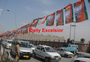 May-5, 2015- SRINAGAR: For the first time in kashmir  Bharatiya Janata Party (BJP) party flags hosting  in front of   the Civil Secretariat  in Srinagar,  on Tuesday. The civil secretariat, which houses the office of the chief minister and his colleagues, reopened in Srinagar, the summer capital of Kashmir, after remaining in Jammu for six months, the winter capital. The Darbar Move is the 142 year old tradition of shifting the civil secretariat and other government offices to Jammu during the winter months and reopening in Srinagar in summer. Photo/ Mohd Amin War