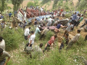 Ill fated bus and injured being evacuated from accident site at village Malothi near Latti on Monday.