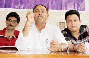 Shadi Lal Pandita, president, Jagti Tenement Committee addressing press conference on Sunday. -Excelsior/ Rakesh