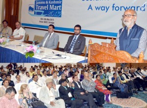 Minister for Education, Naeem Akhtar addressing dignitaries at “J&K Travel Mart-2015” at Srinagar on Sunday.