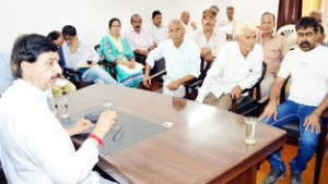 MoS Pawan Gupta listening to public grievances during redressal camp on Saturday.