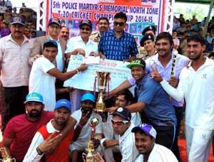 IGP Jammu Danesh Rana and DIG Shakeel Beig presenting cash award and trophy to winners at Sports Stadium in Kathua. 