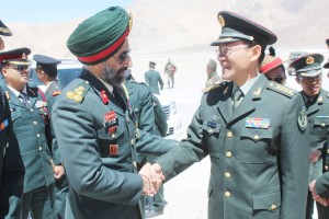 Top Army officials shake hands during border-meeting at Chushul in Ladakh sector on Friday.
