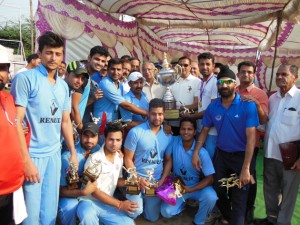 Jubilant team of New Challengers Cricket Club posing along with chief guest, Sham Lal Sharma, former Minister and other dignitaries after clinching JKPL T20 title trophy in Jammu. 