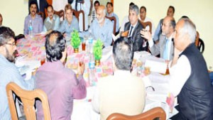 Minister for Horticulture, Abdul Rehman Veeri chairing meeting at Srinagar on Saturday.